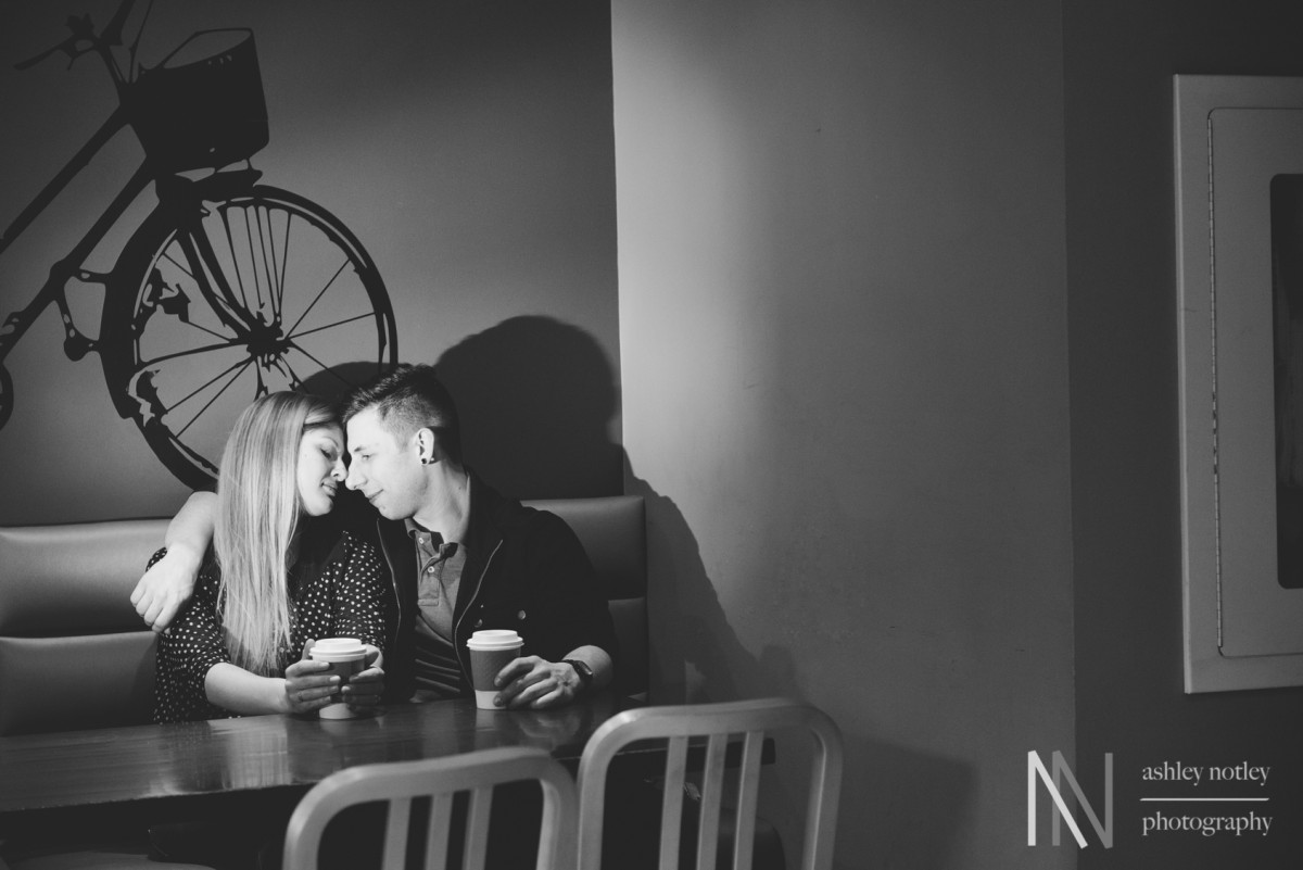 couple drinking coffee at planet coffee in the market in ottawa