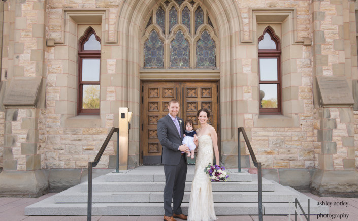 Bride and groom with daughter in front of the Museum of Nature in Ottawa