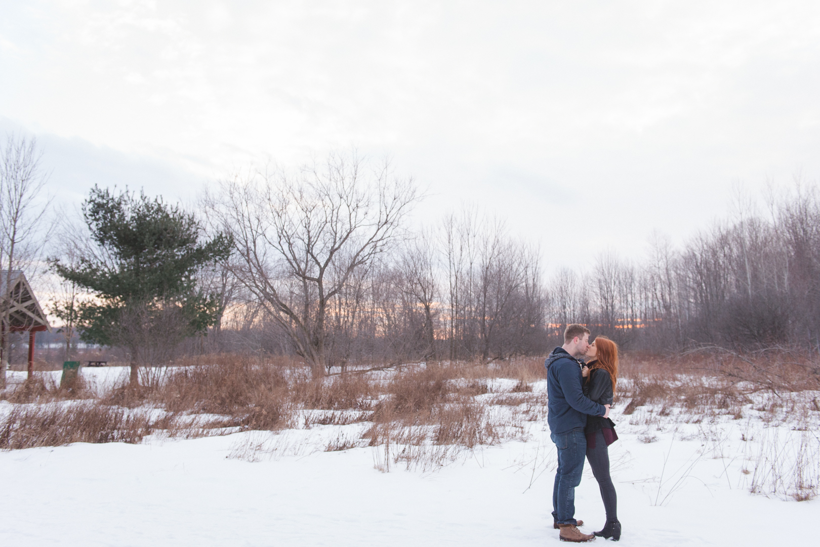 Couple kissing in the fields at mer bleue bog