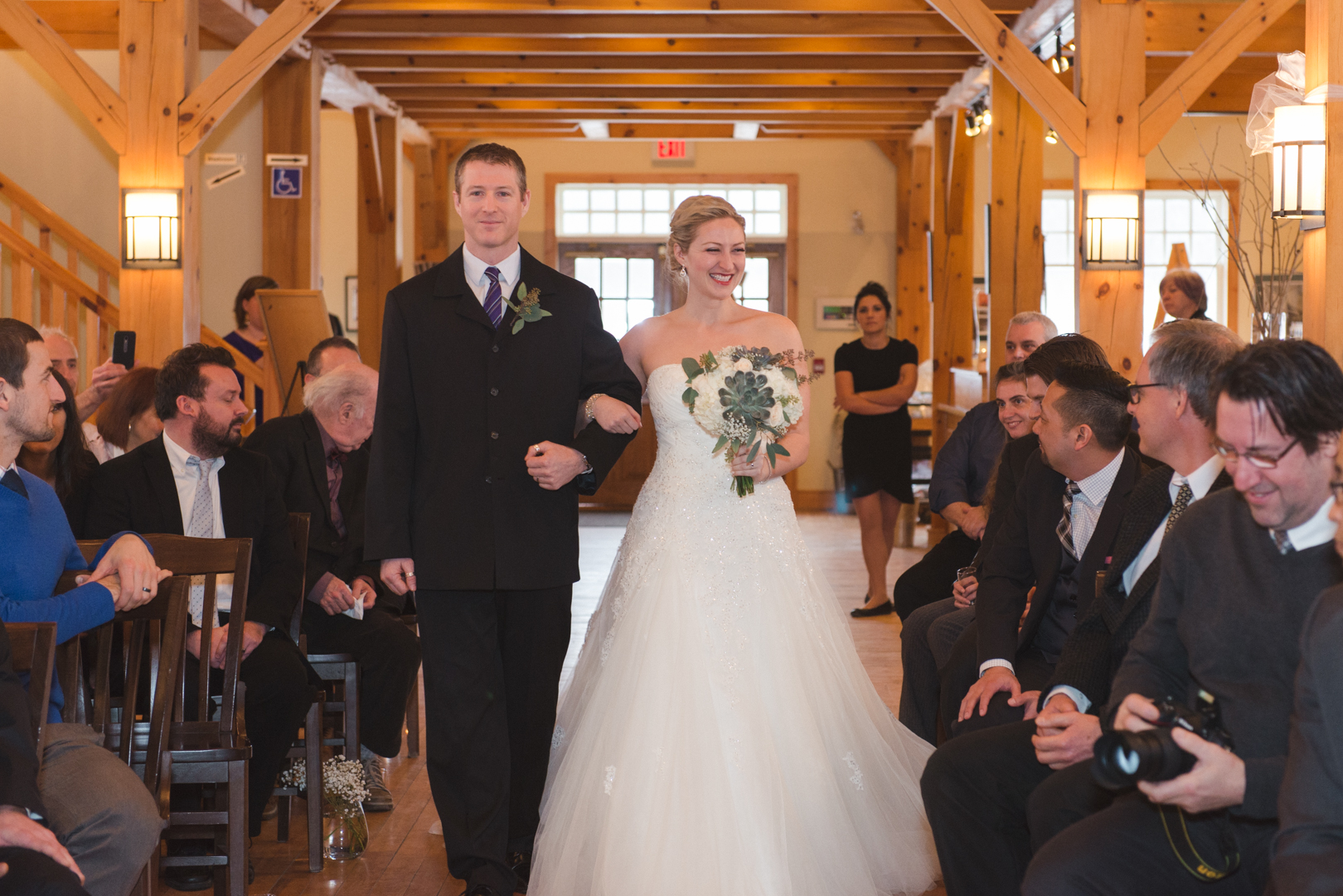 Bride and her brother walking down the aisle