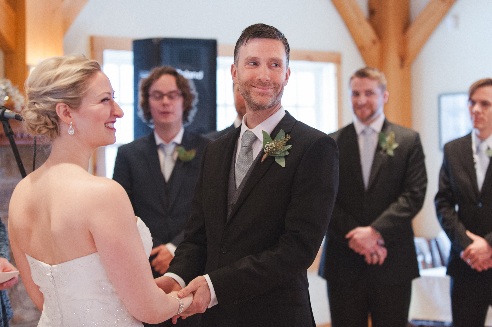 Groom laughing during wedding ceremony