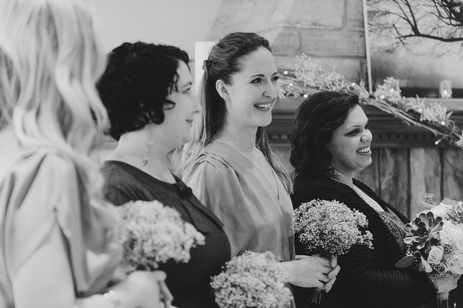 Bridesmaids laughing at wedding ceremony