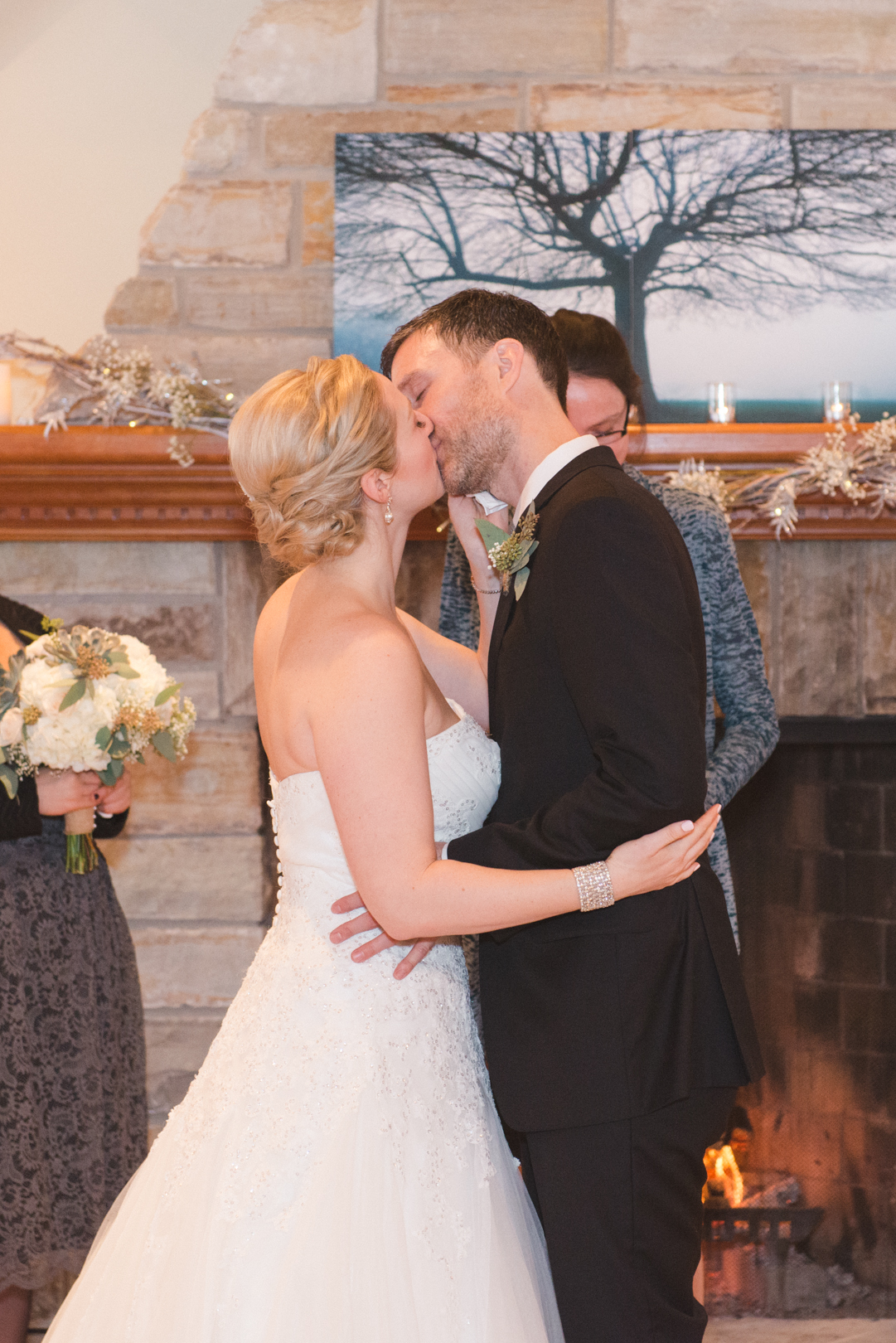 Bride and groom first kiss at Temple's sugar bush