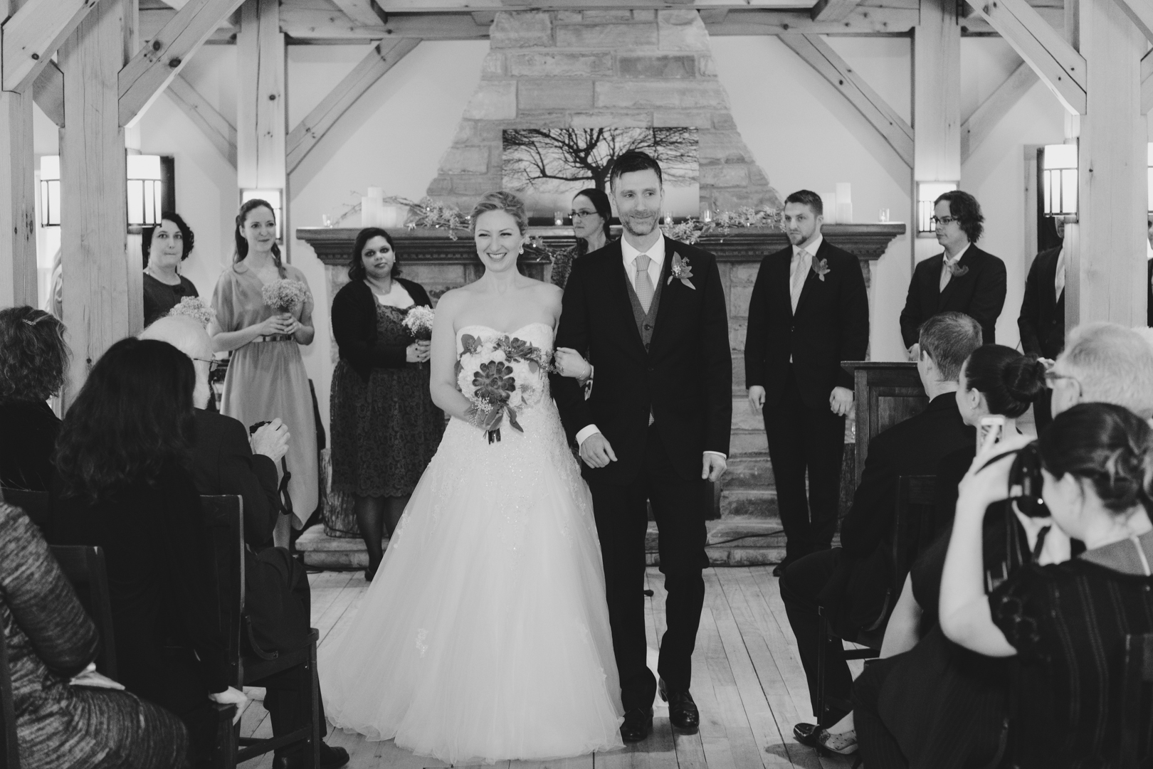 Bride and groom walking down the aisle as man and wife