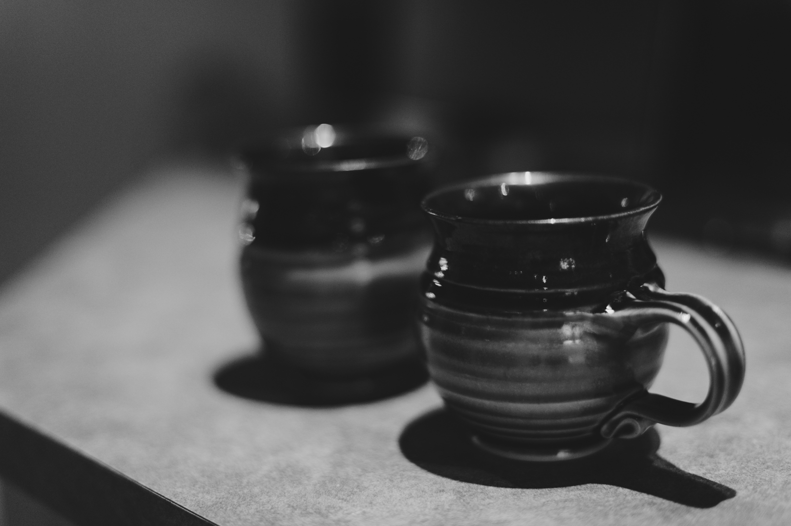 morning cups of coffee on a saturday morning in clay mugs. Photo by Ashley Notley Photography.