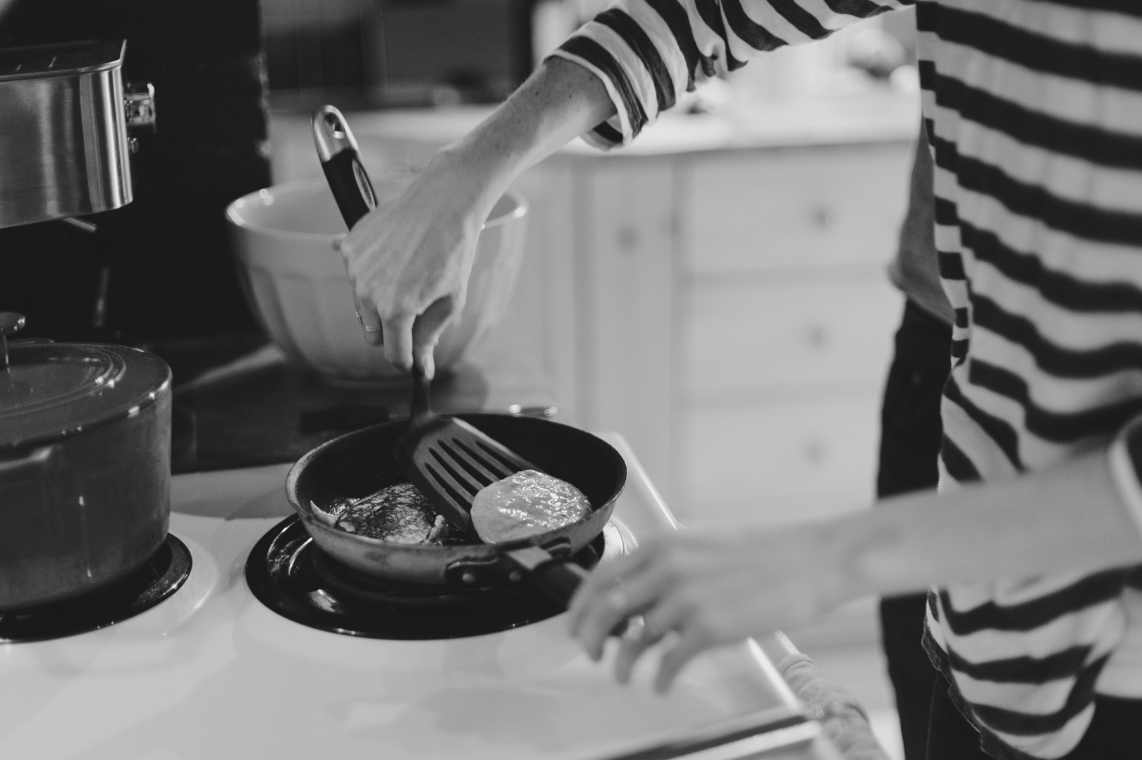 Mom making pancakes on Saturday morning. Photo by Ashley Notley Photography.