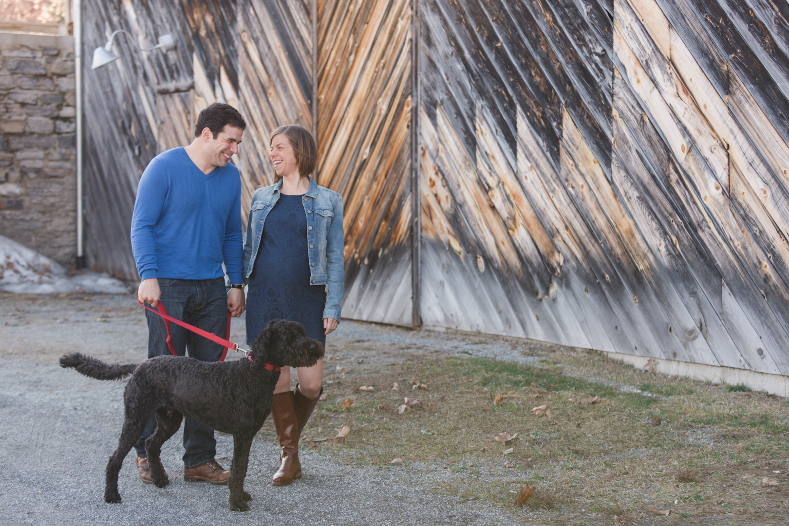 couple and dog walking maternity photos