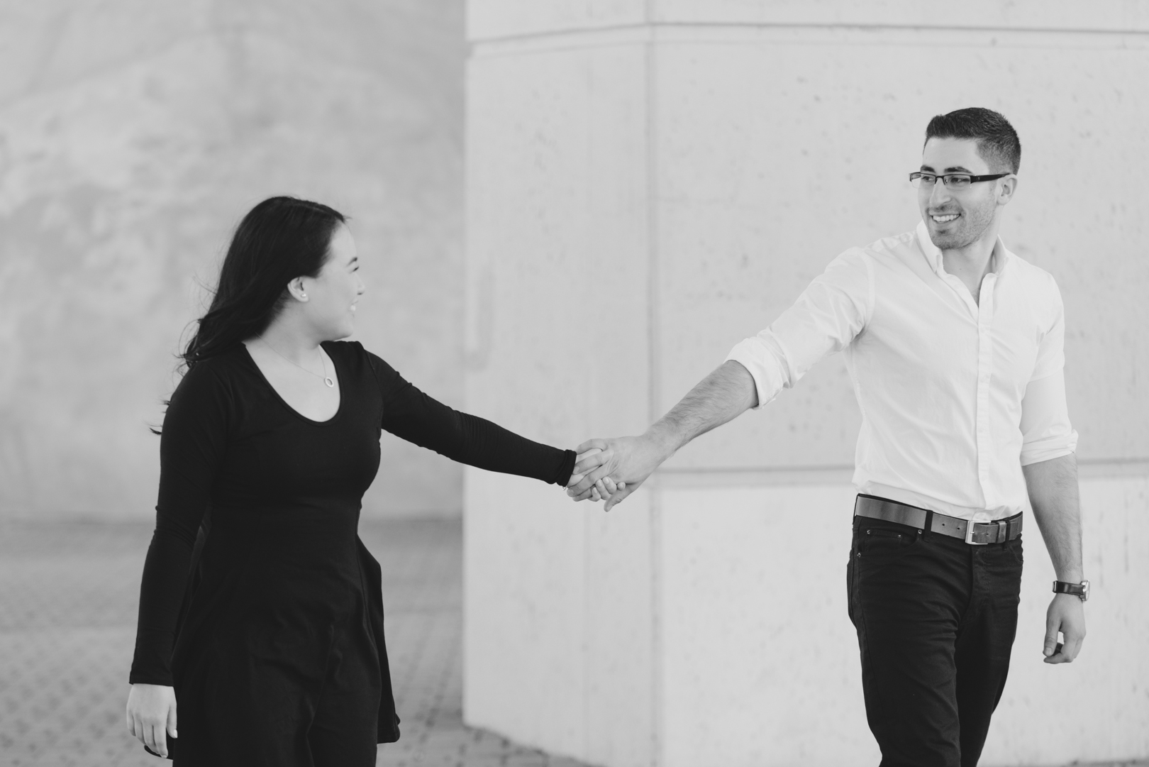 Couple in downtown Toronto underneath Gardiner Expressway