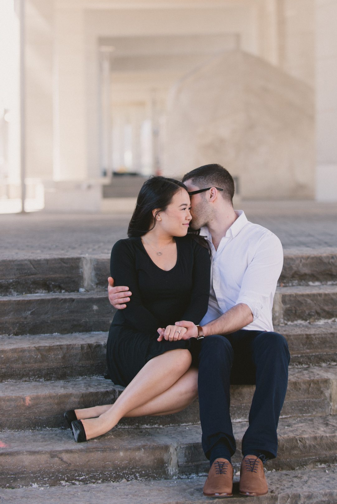 Couple in downtown Toronto underneath Gardiner Expressway