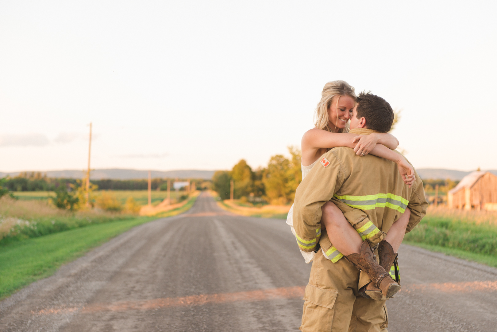 firefighter and bride to be kissing