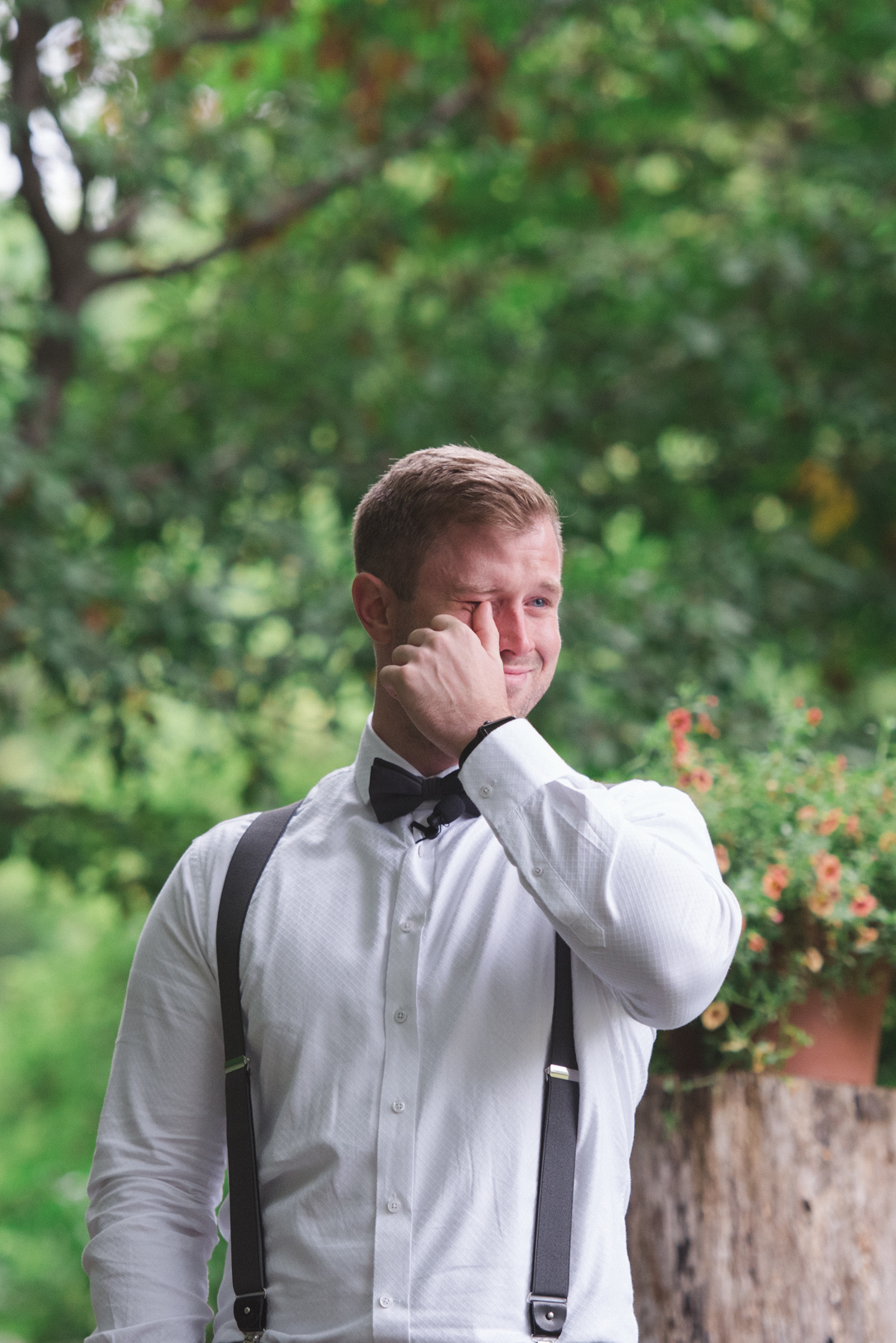 groom tearing up seeing bride for the first time
