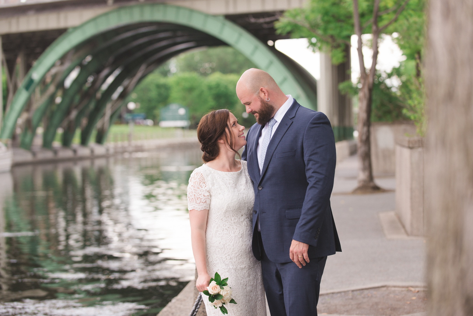 bride and groom by canal and laurier bridge