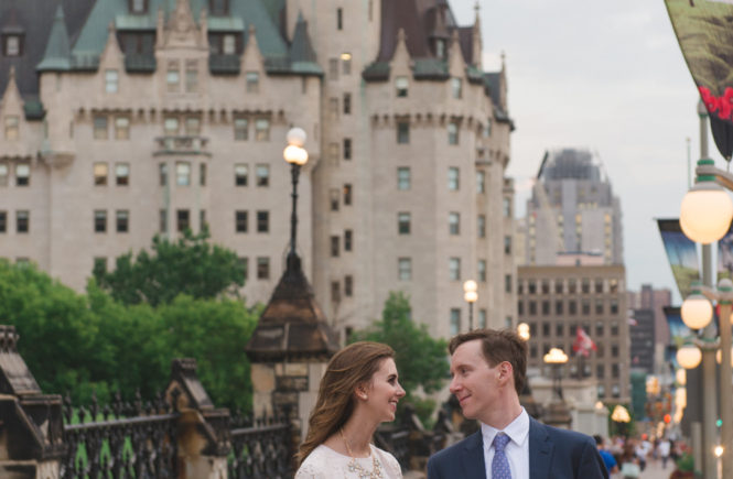 Newlyweds standing on Wellington Street by the Chateau Laurier in Ottawa