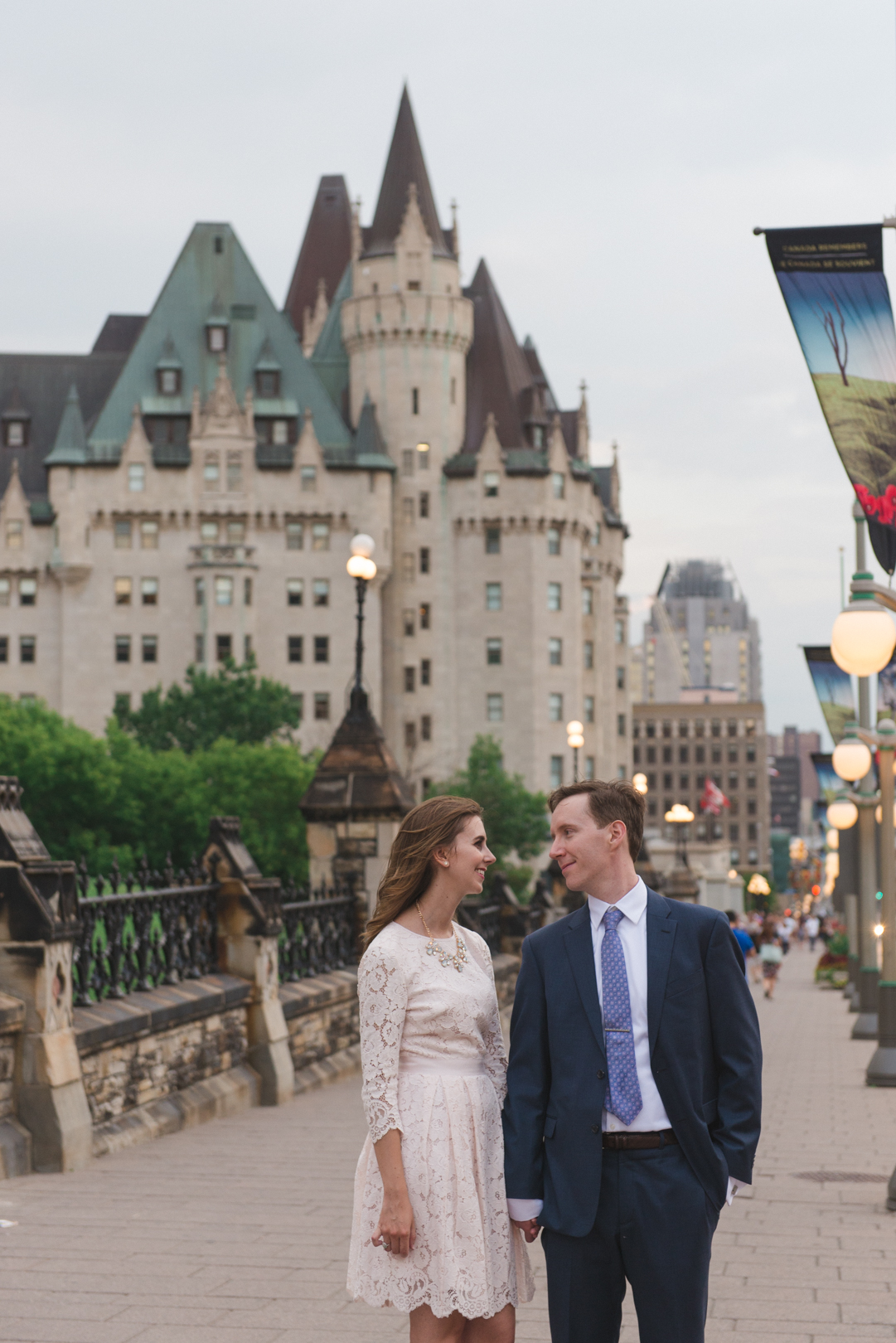 Newlyweds standing on Wellington Street by the Chateau Laurier in Ottawa