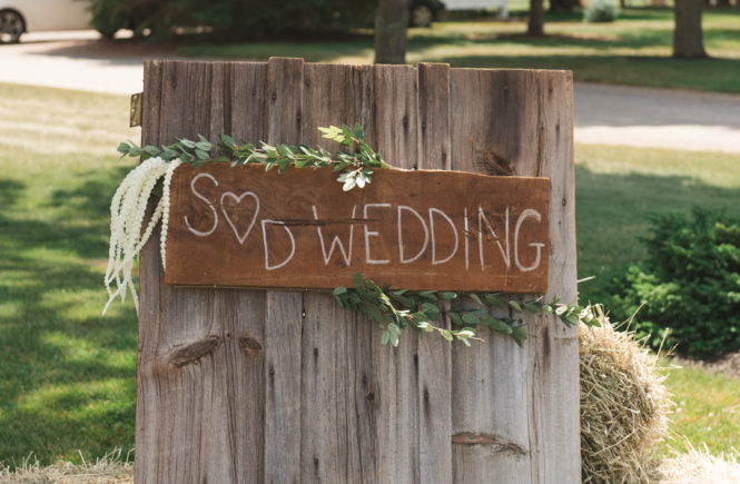 wedding sign against barn board