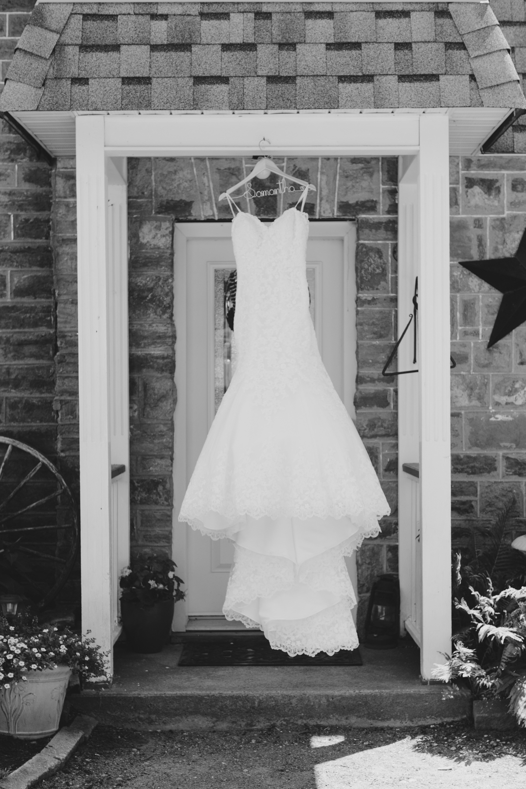 wedding dress hanging by front door