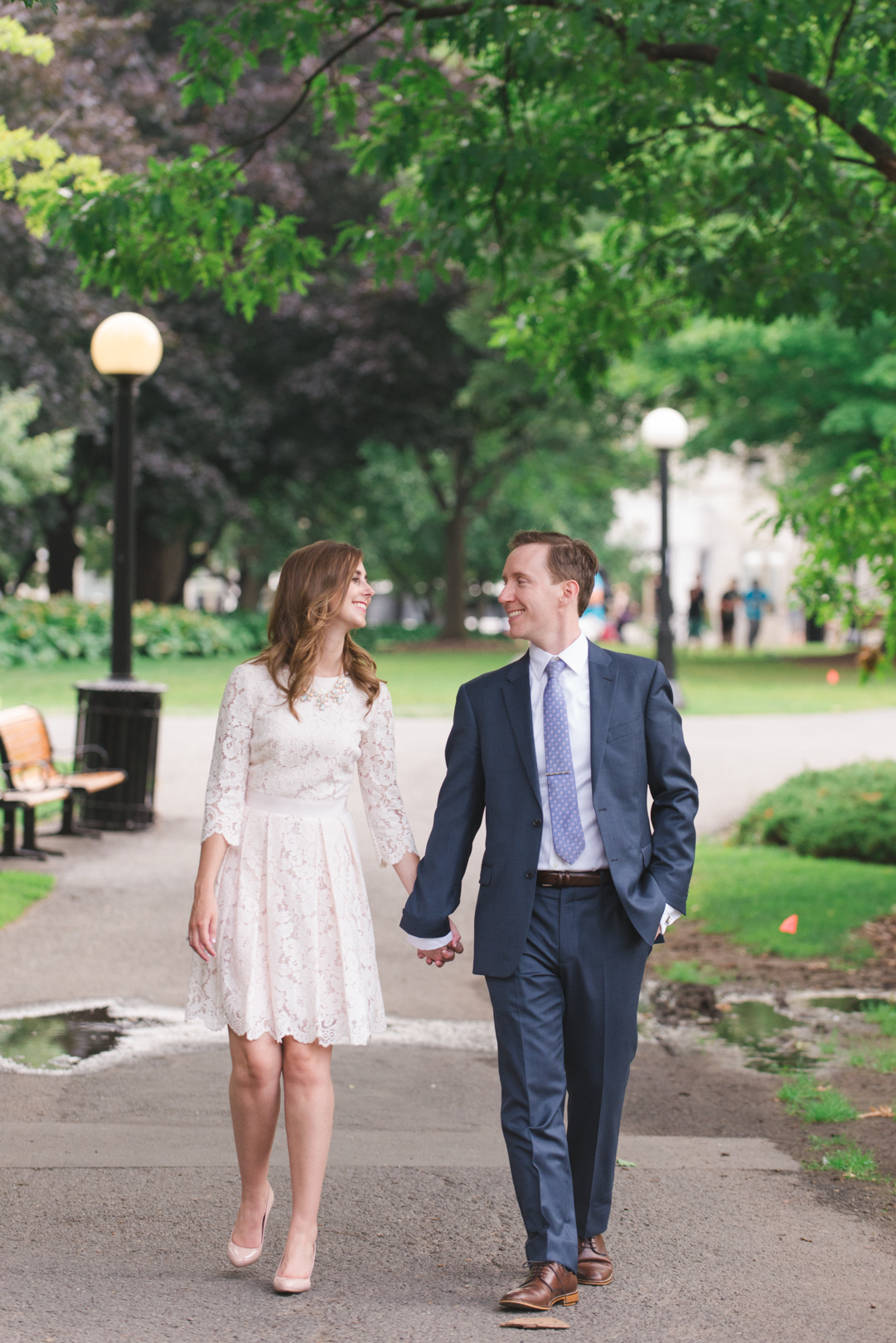 newlyweds walkng through confederation park