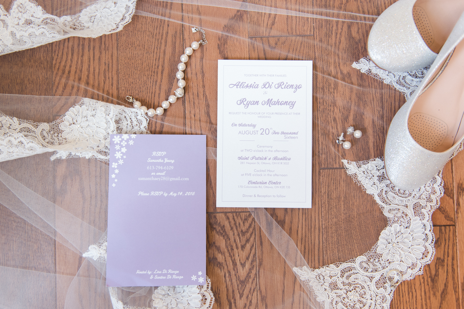 bride's cathedral veil with wedding invitations