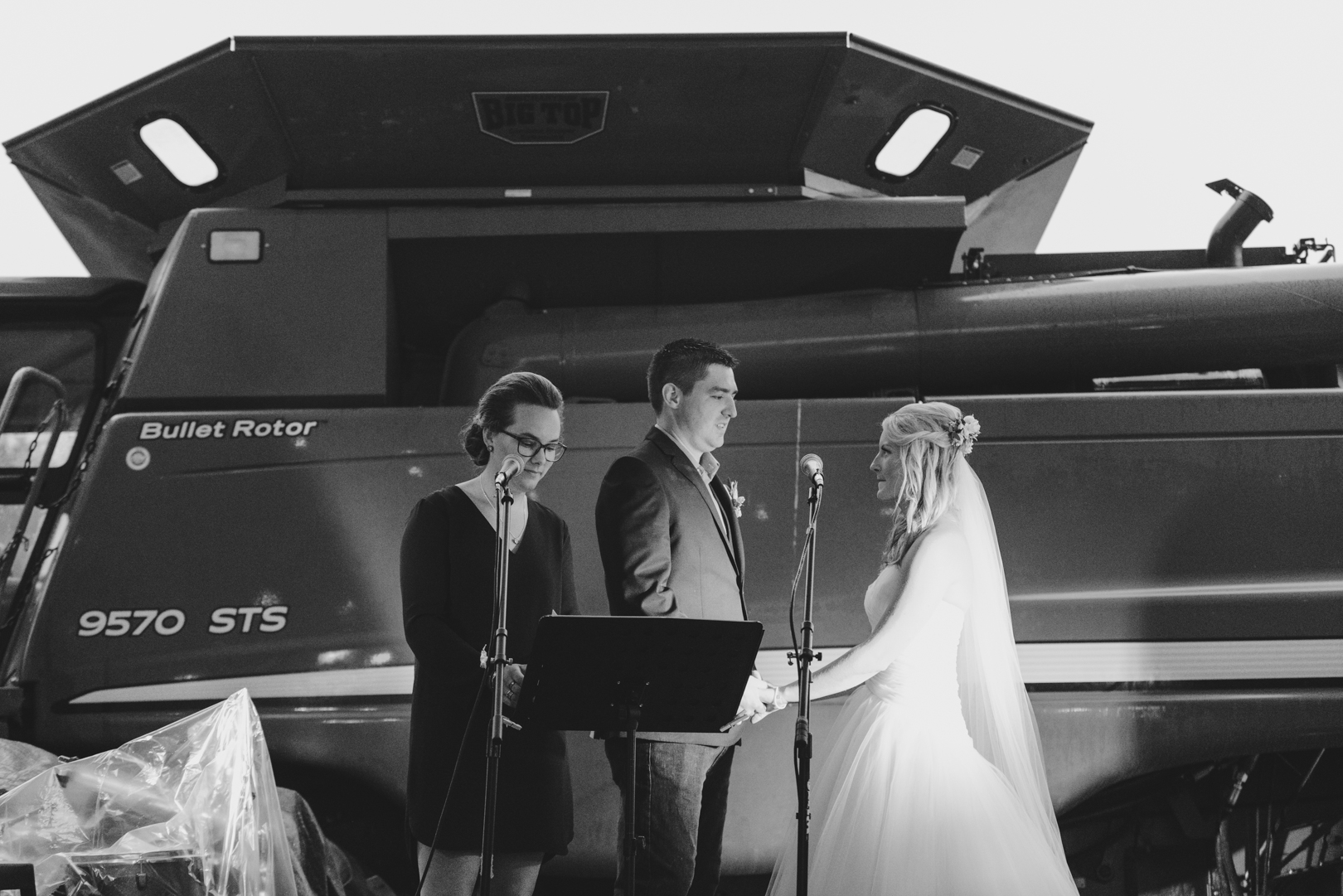 bride and groom vows on hay wagon