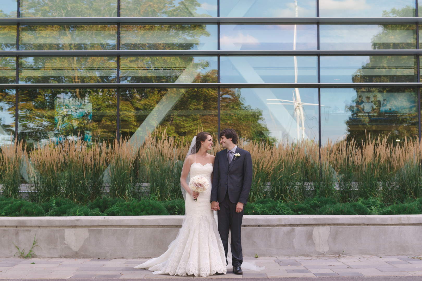 bride and groom in front of navy base at dow's lake