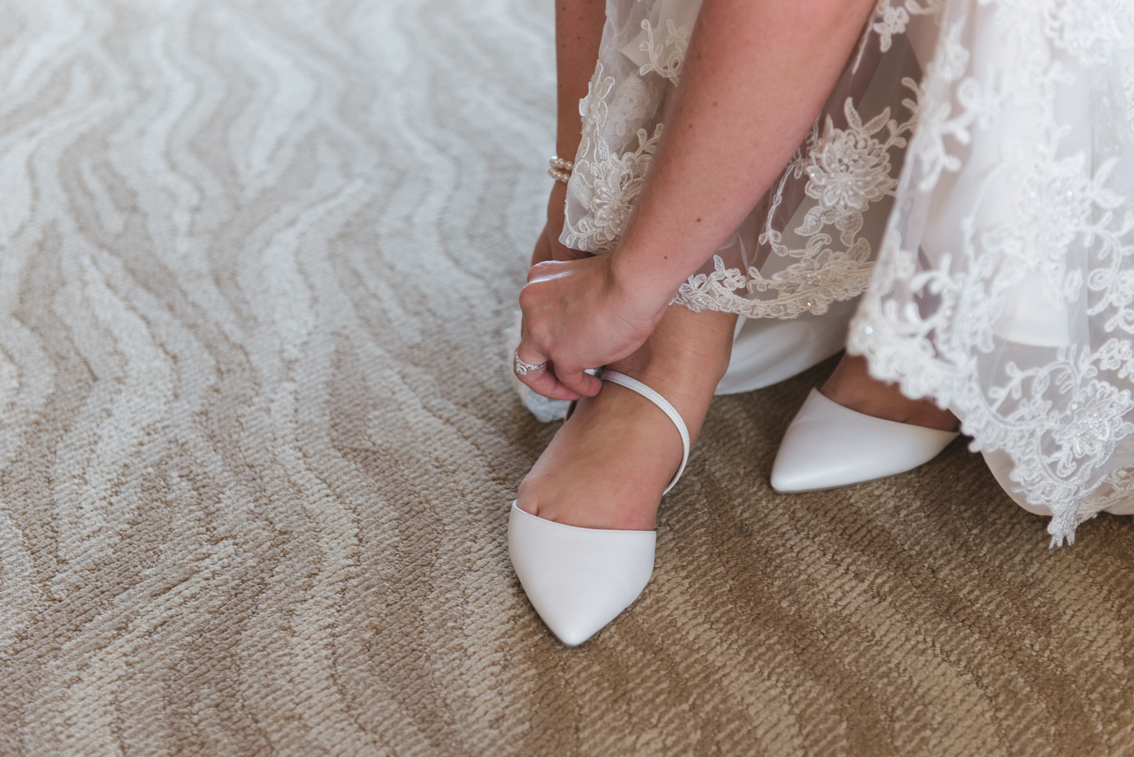 bride putting on her shoes