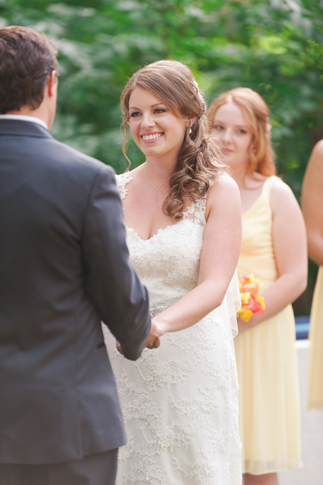 Bride smiling at the groom during the ceremony