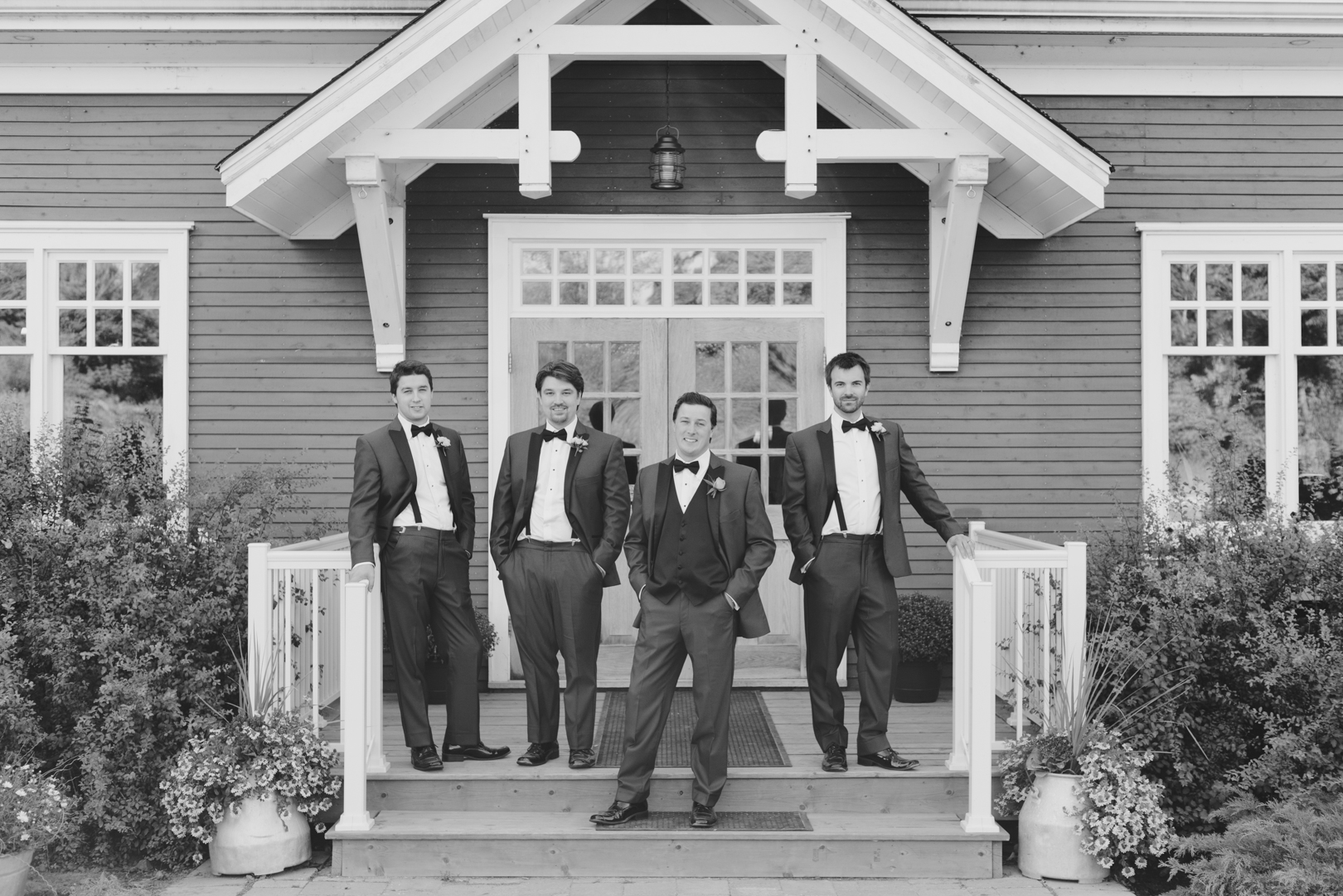 Groomsmen on the front steps of Temples Sugar Bush