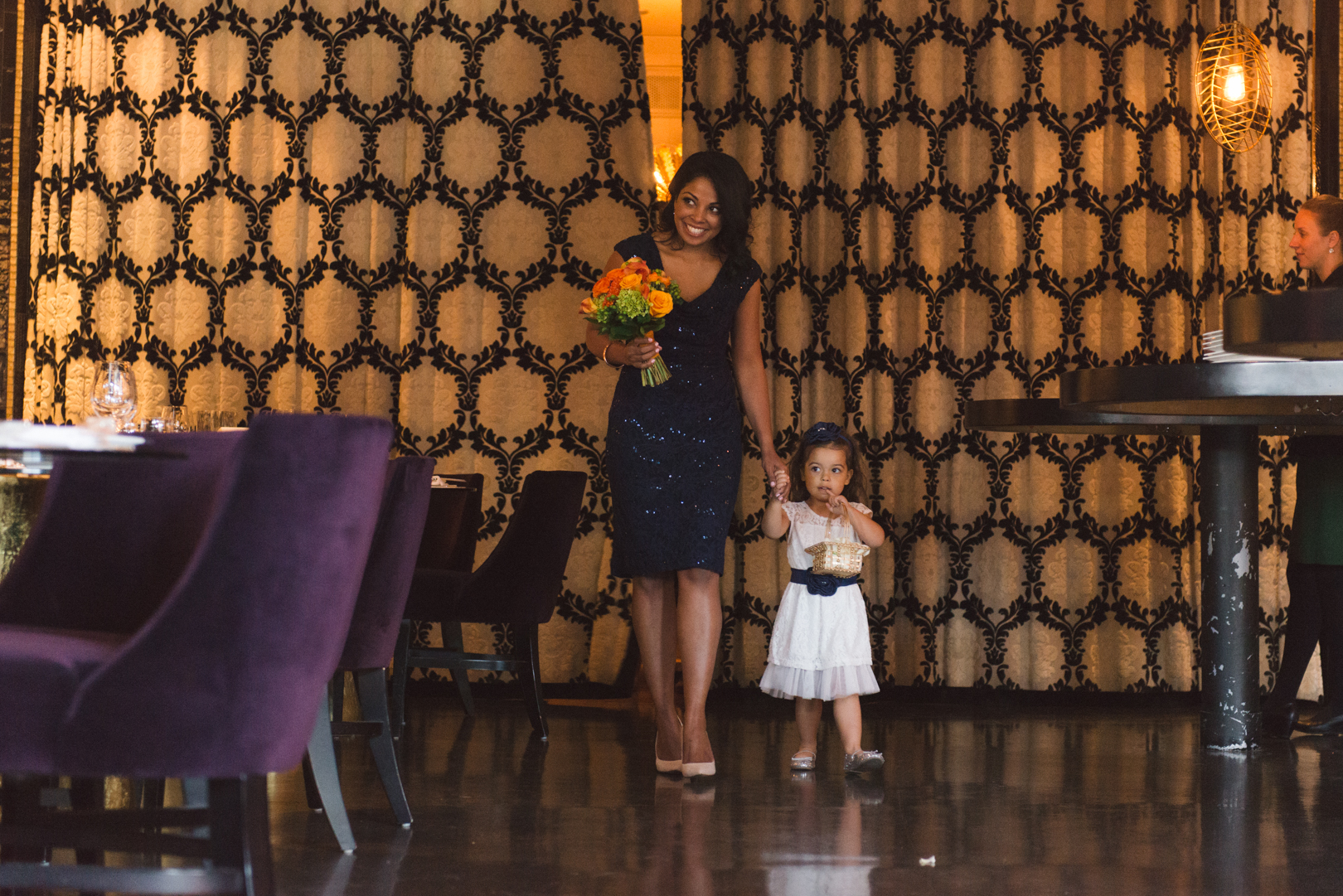 bridesmaid and flower girl walking down the aisle at restaurant eighteen in ottawa