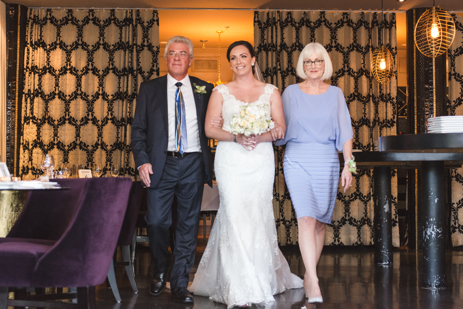 bride and her parents walking down the aisle at restaurant eighteen in ottawa