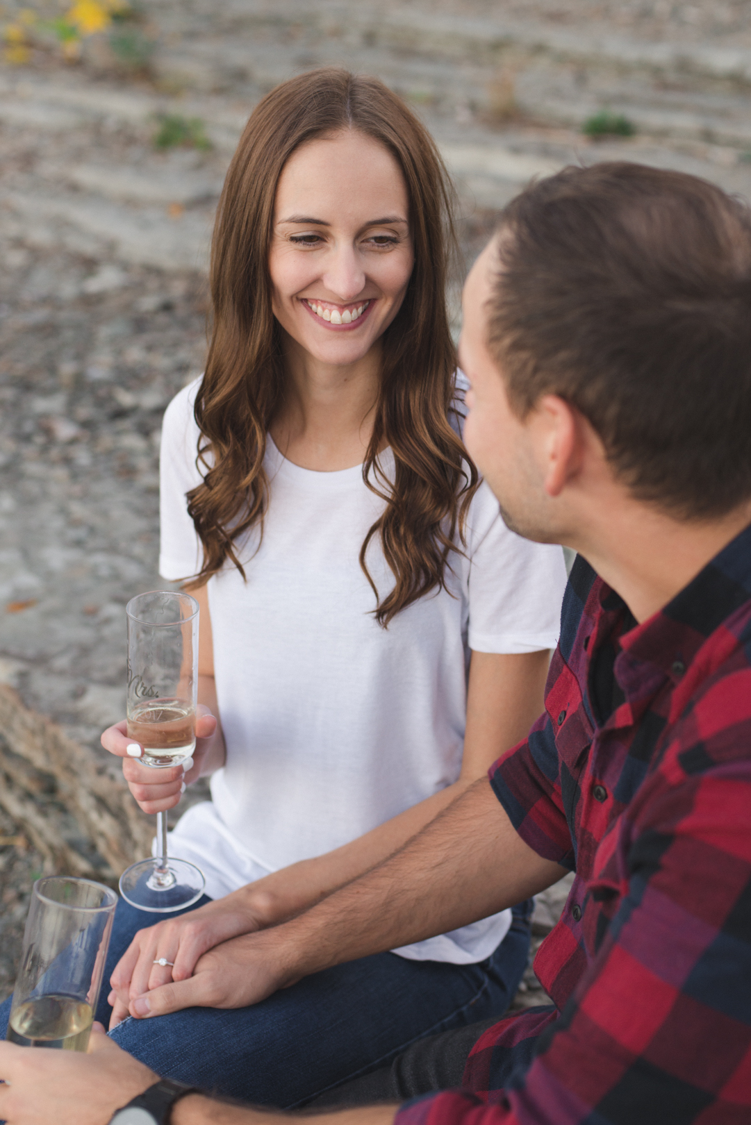 engaged couple enjoying champagne together