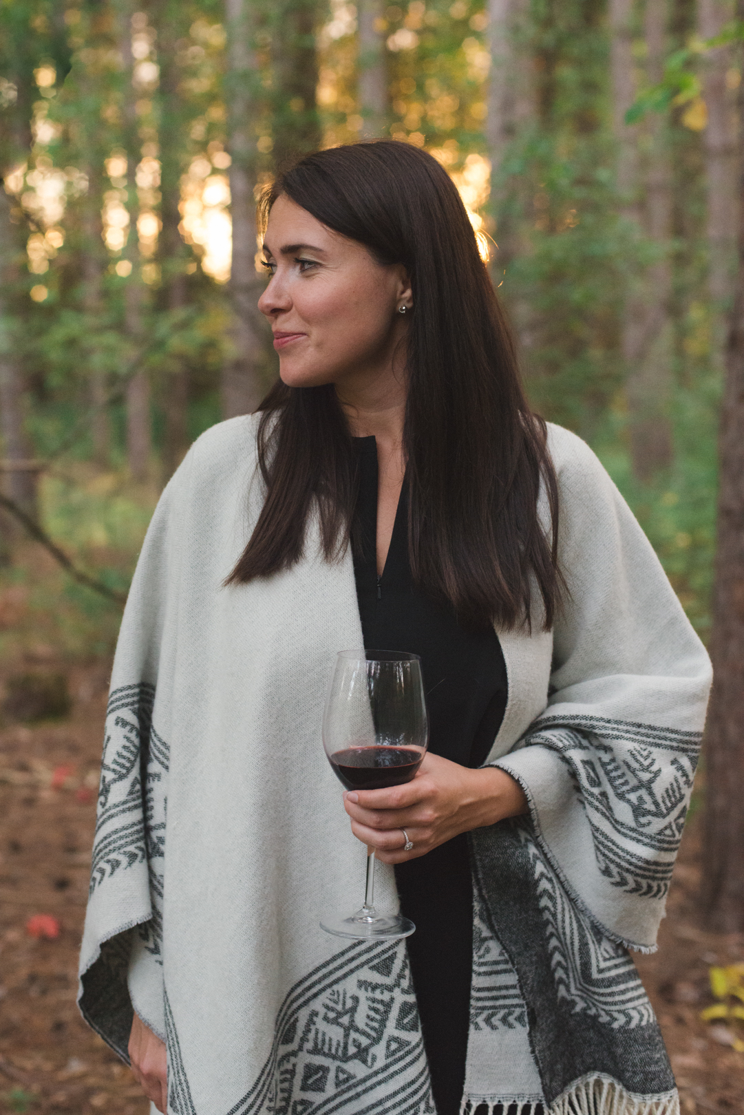 bride to be holding a glass of red wine