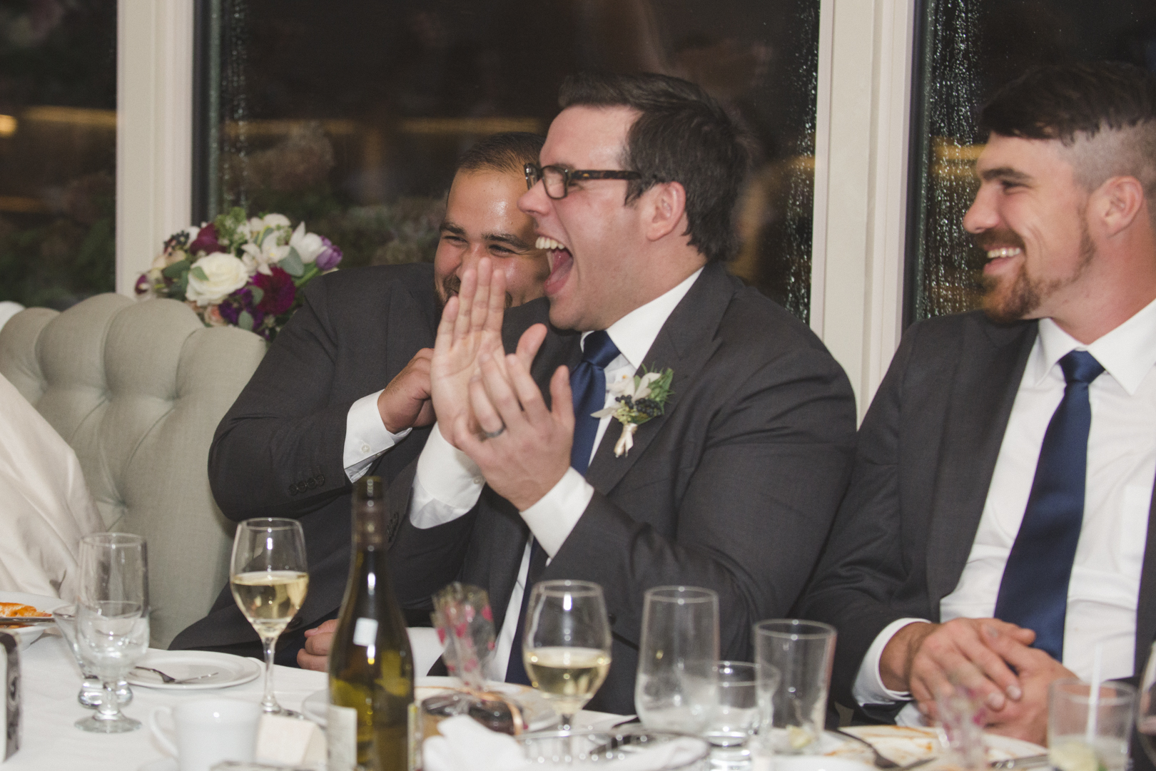 best man laughing at le belvedere wedding reception