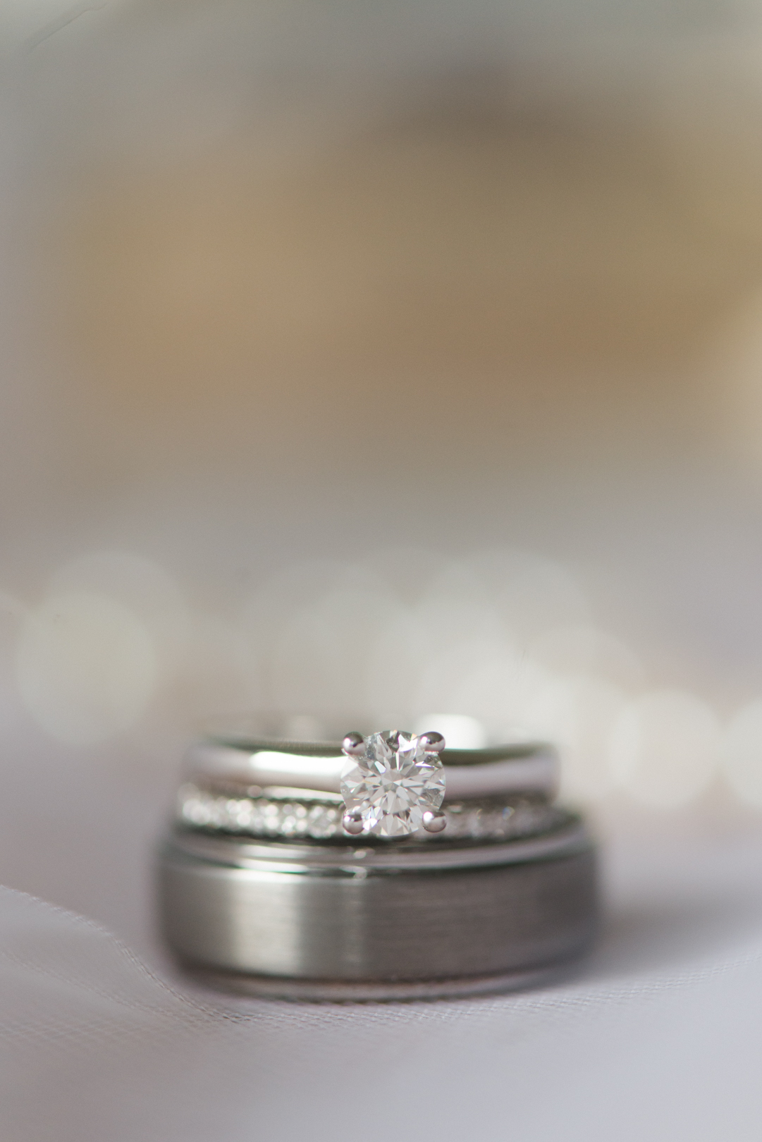 weddings bands and engagement ring bokeh