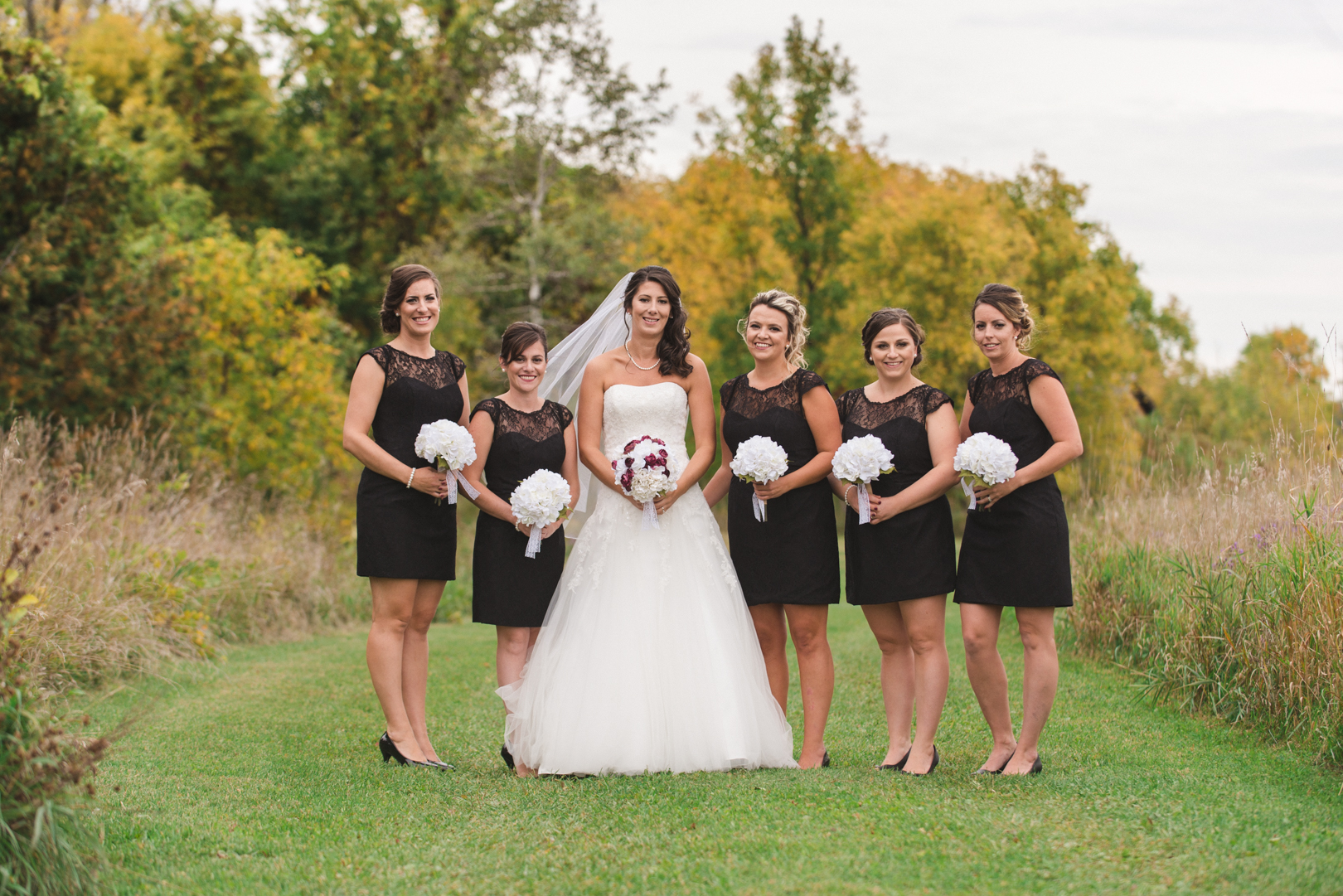 bridesmaids in black at fall wedding