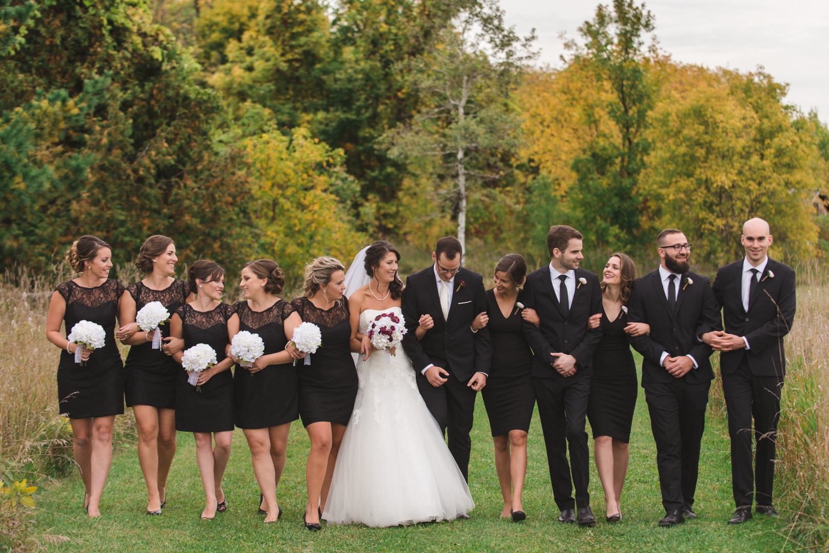 wedding party in all black walking together