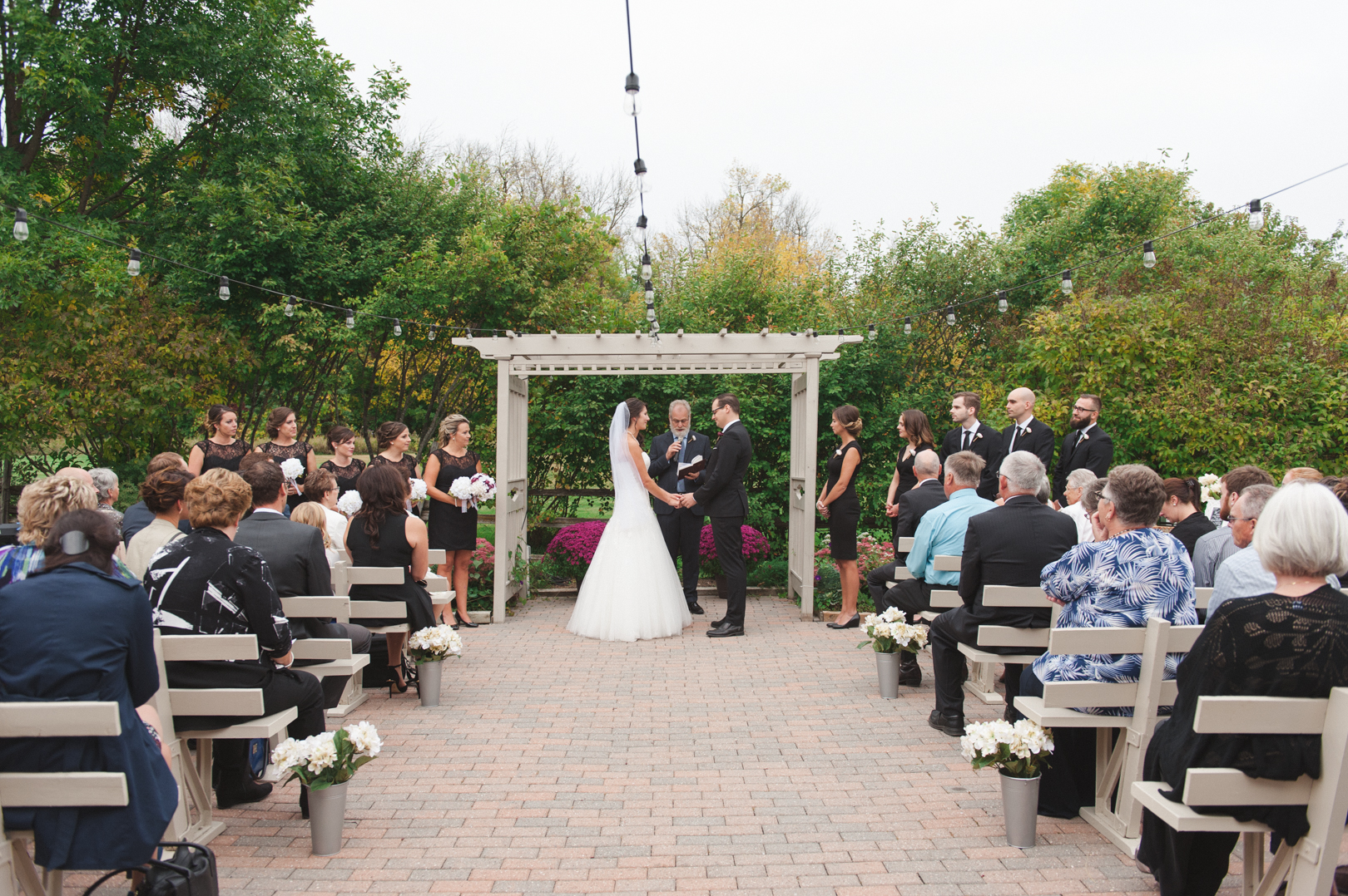 wedding ceremony on the patio at the garden house at strathmere