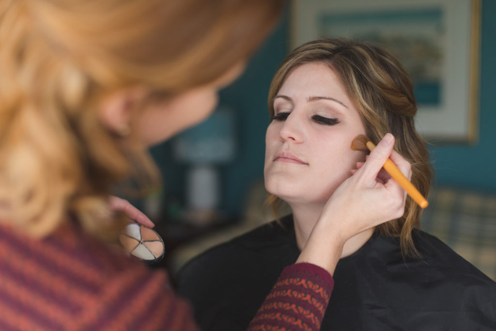 bride getting her makeup done