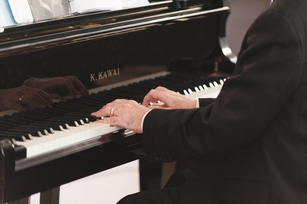 piano being played at wedding ceremony