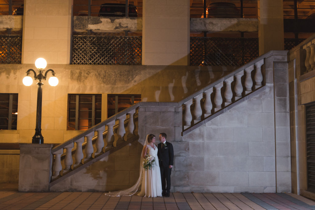 bride and groom outside the chateau laurier steps at night