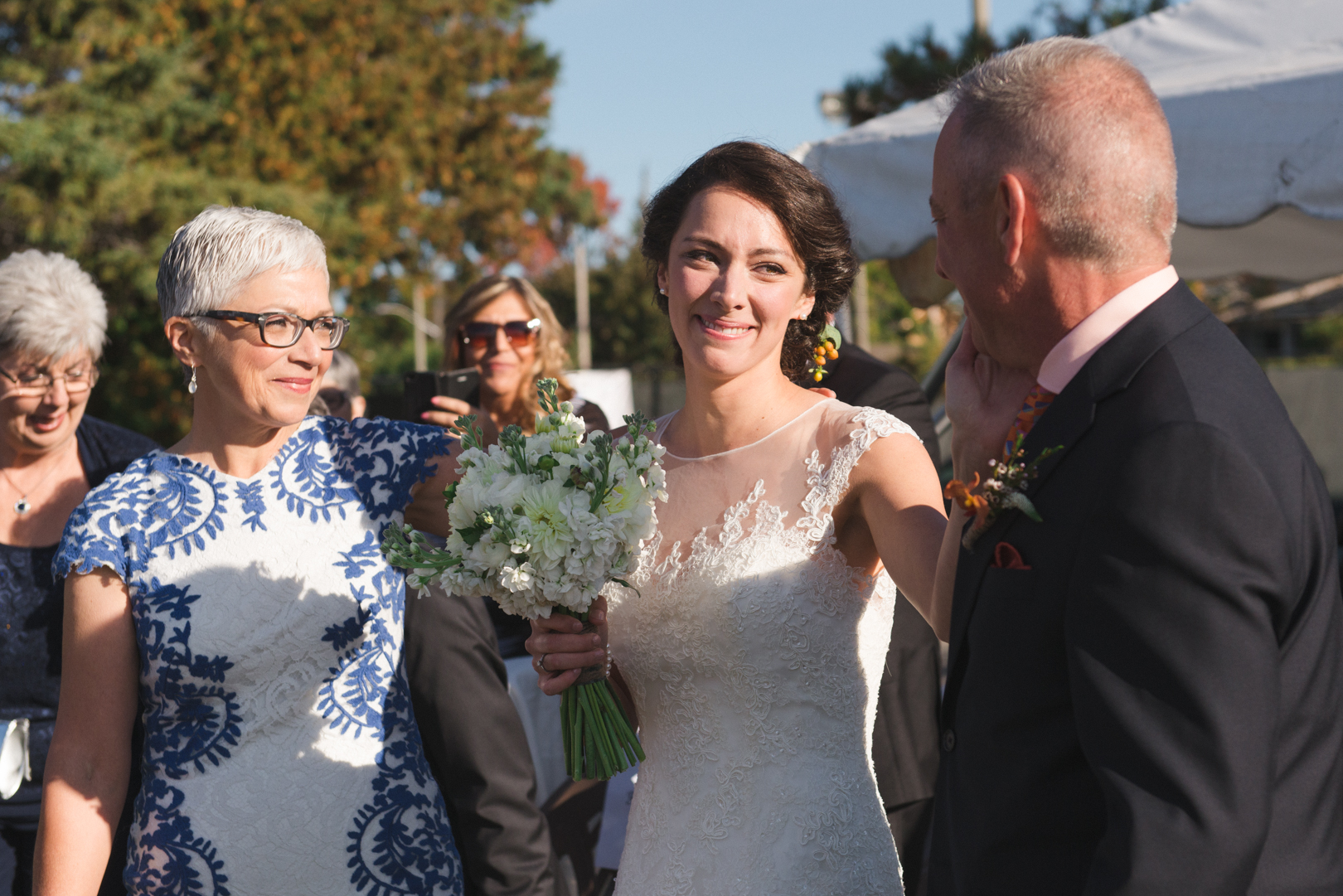 Bride tearing up hugging her father before wedding ceremony