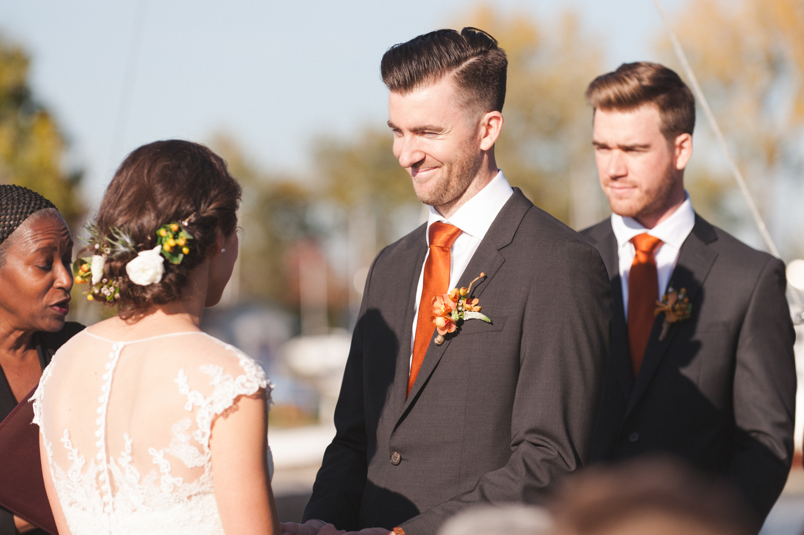 Groom smiling at bride during wedding ceremony