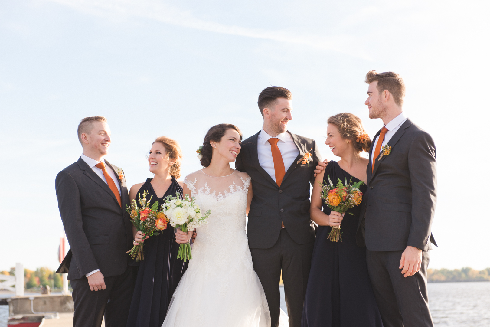 Wedding party laughing together