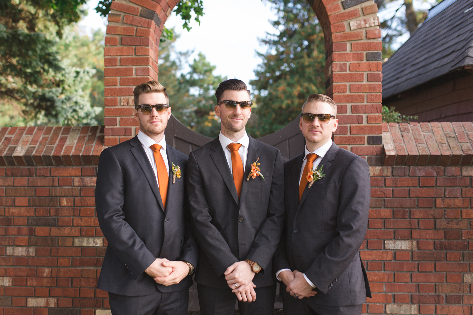 groom and groomsmen wearing the same sunglasses