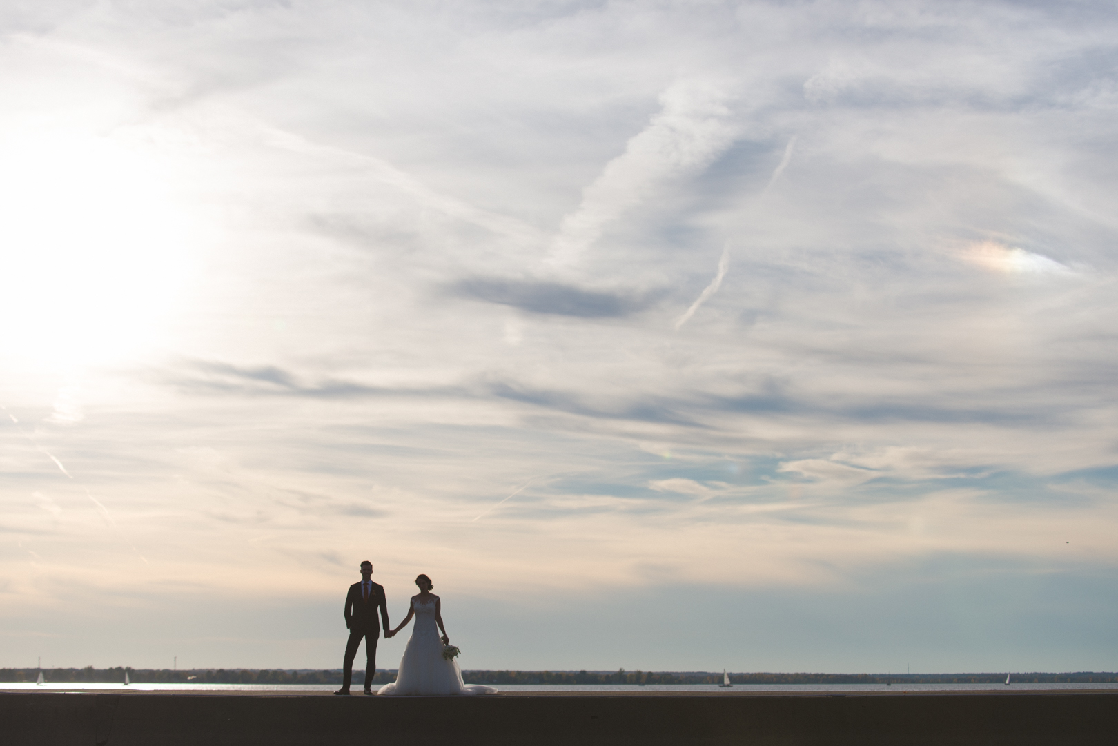 silhouette of bride and groom at sunset