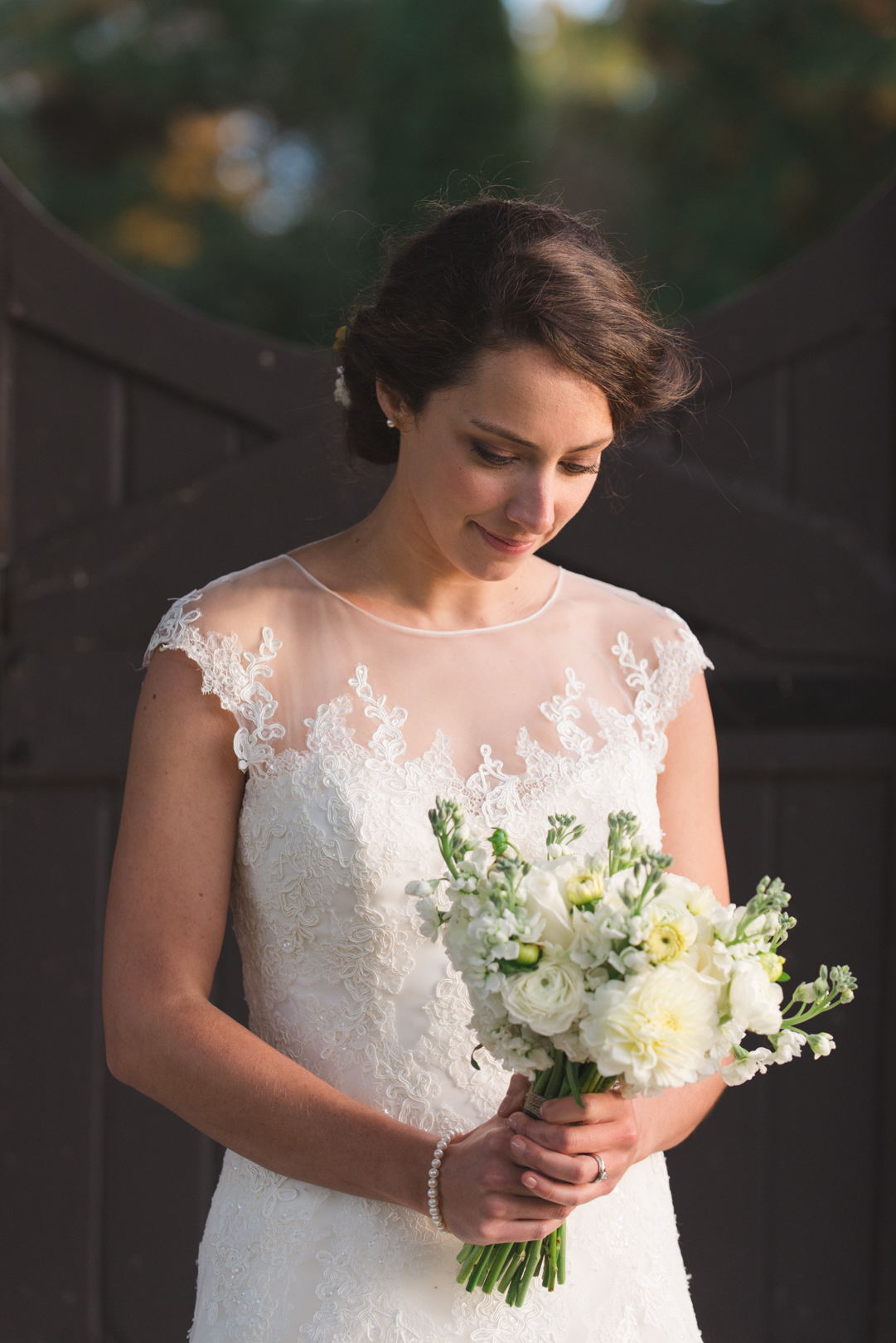 bride looking down at pollen nation bouquet