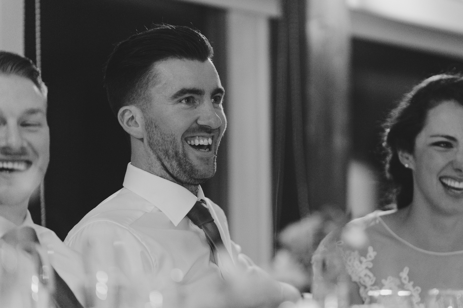 groom laughing at speeches