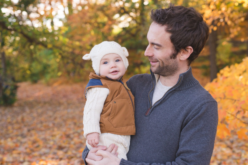 Dad and son among the fall leaves at the Ottawa arboretum