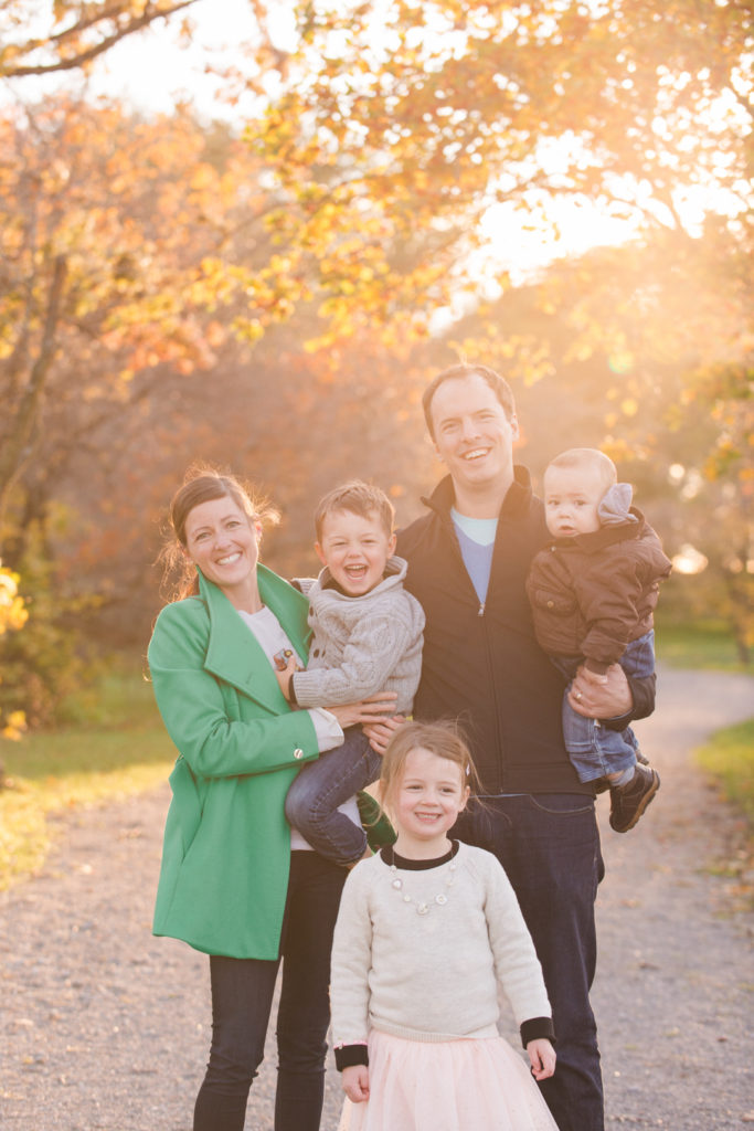 Parents and three children at the Ottawa arboretum on a sunny fall day