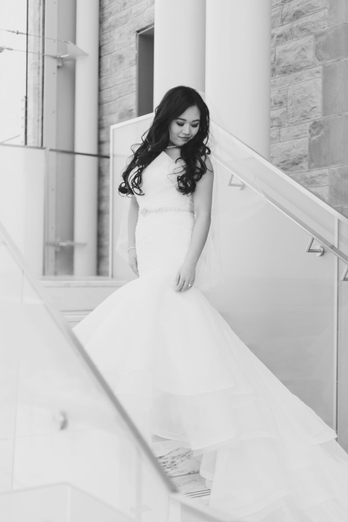 Bride standing on the staircase of the Museum of Nature in Ottawa