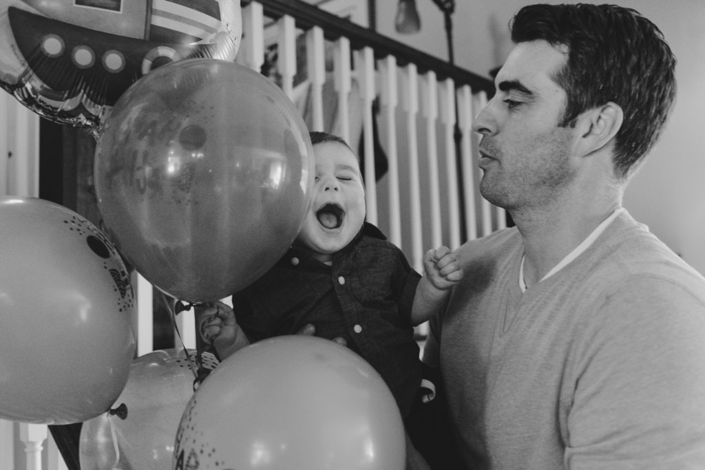 Birthday boy playing with balloons